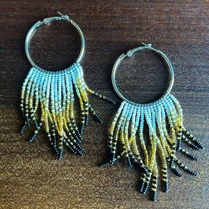 White, Gold and Black beaded hoop earrings.